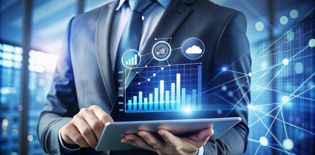 Businessman using tablet with digital graphics.